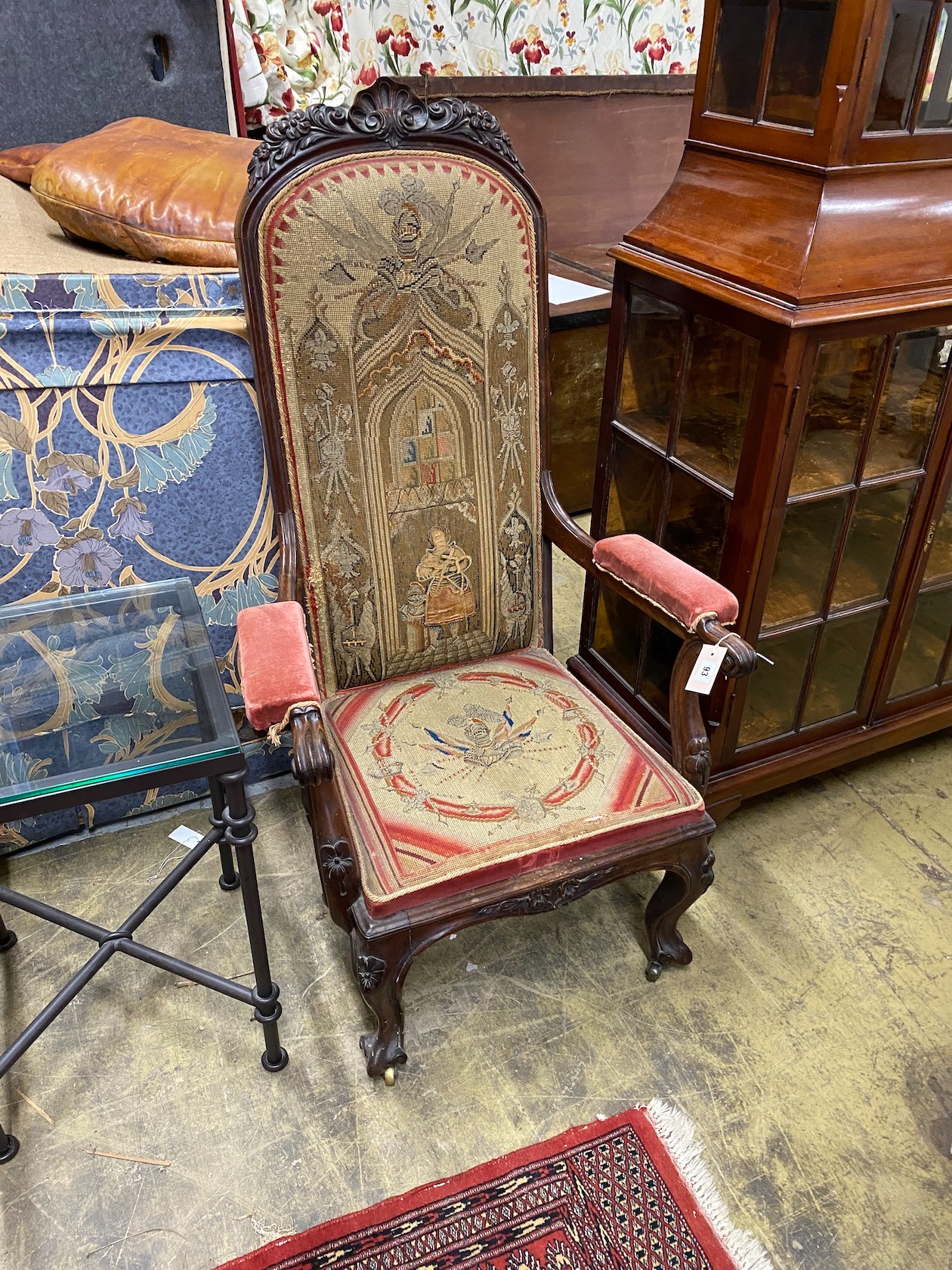 A Victorian carved rosewood elbow chair with tapestry seat and back, width 69cm, depth 47cm, height 122cm
